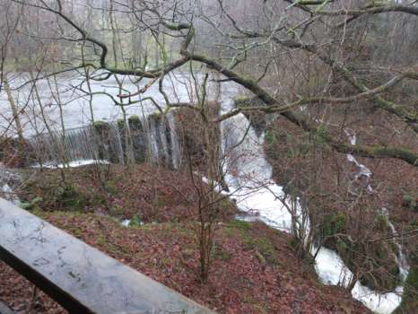 Flood water over the weir down at the tarn